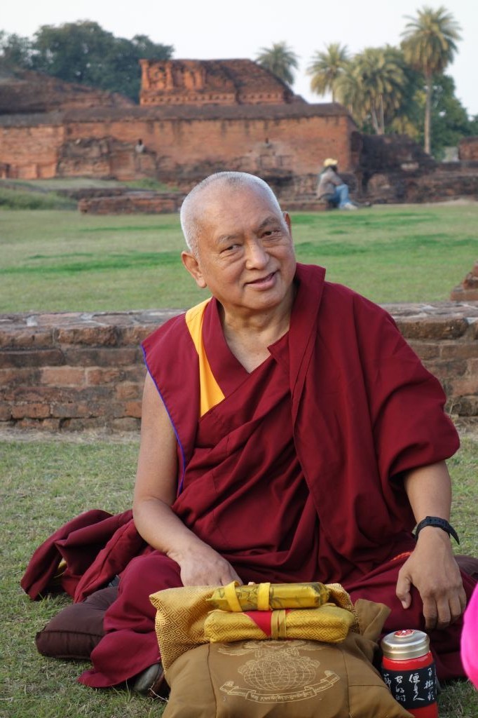 Lama Zopa Rinpoche teaching in the ruins of Nalanda Monastery, once the largest monastic university of the ancient world. (Photo Ven Roger Kunsang)