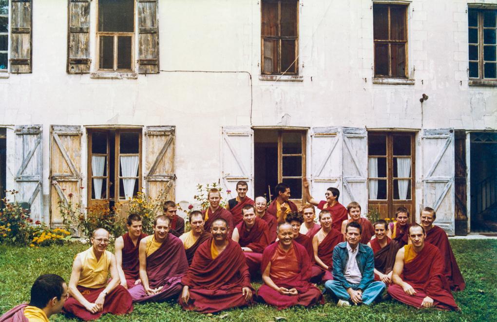 International Mahayana Institute Sangha, Nalanda Monastery, Lavaur, France, 1983. Photo includes Adrian Feldmann (Thubten Gyatso), Chodron Thubten (Cherry Greene), Dieter Kratzer, Lama Yeshe, Merry Colony, Sangye Khadro (Kathleen McDonald), Geshe Jampa Tegchok. Included in the photo a local priest, Father Bastiani, wearing blue.