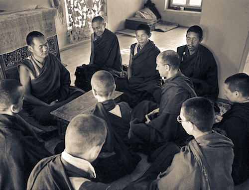 Lama Yeshe, Lama Zopa Rinpoche, Lama Lhundrup, and Lama Pasang with new monastics including Nick Ribush and Yeshe Khadro (Marie Obst) in the gompa (shrine room) at Kopan Monastery, Nepal, 1974.(Photographer unknown)