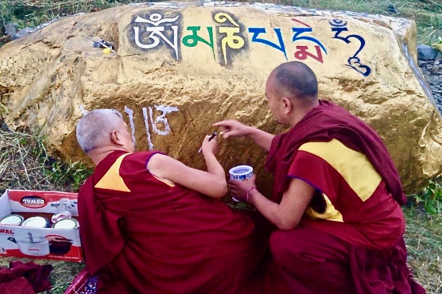 Lama Zopa Rinpoche paints mantra on a rock in Garsha Phakpa, Lahul, India, 2015. (Photo Ven Sangpo)
