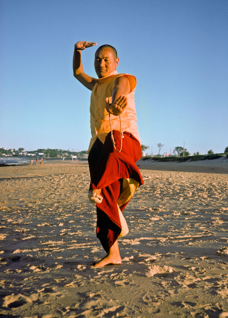 Lama Yeshe dancing/debating on the beach after the month-long course at Chenrezig Institute, Australia, 1975. (Photo by Anila Ann)